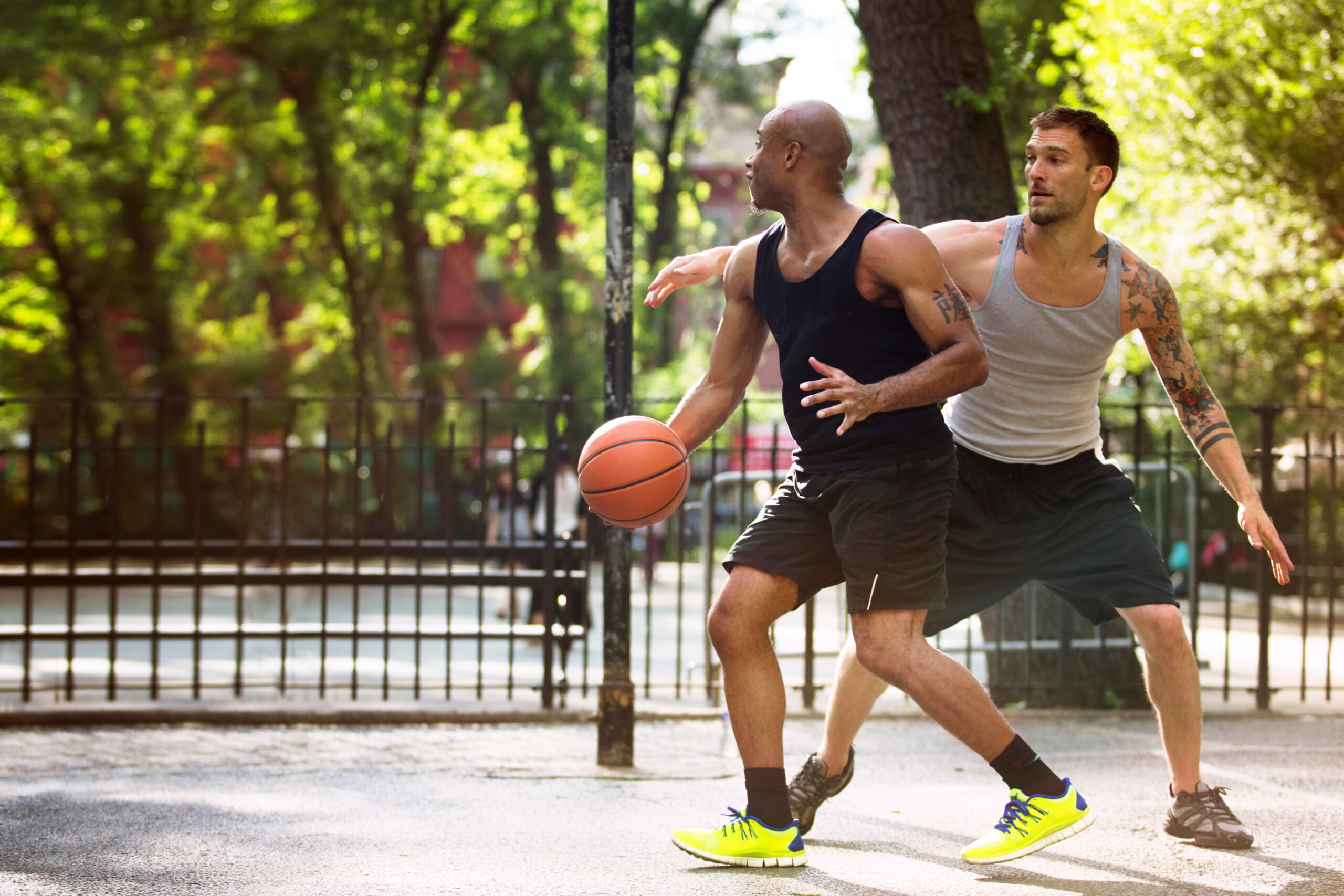 two men playing basketball