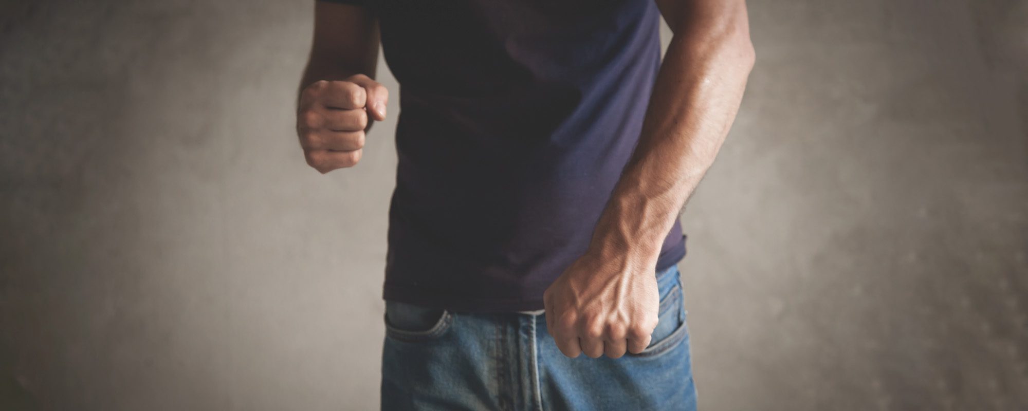 caucasian angry man threatening with fist