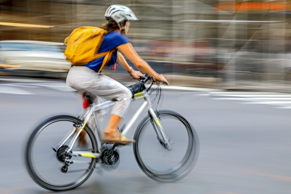 delivery on the bike in traffic on the city roadway motion blur