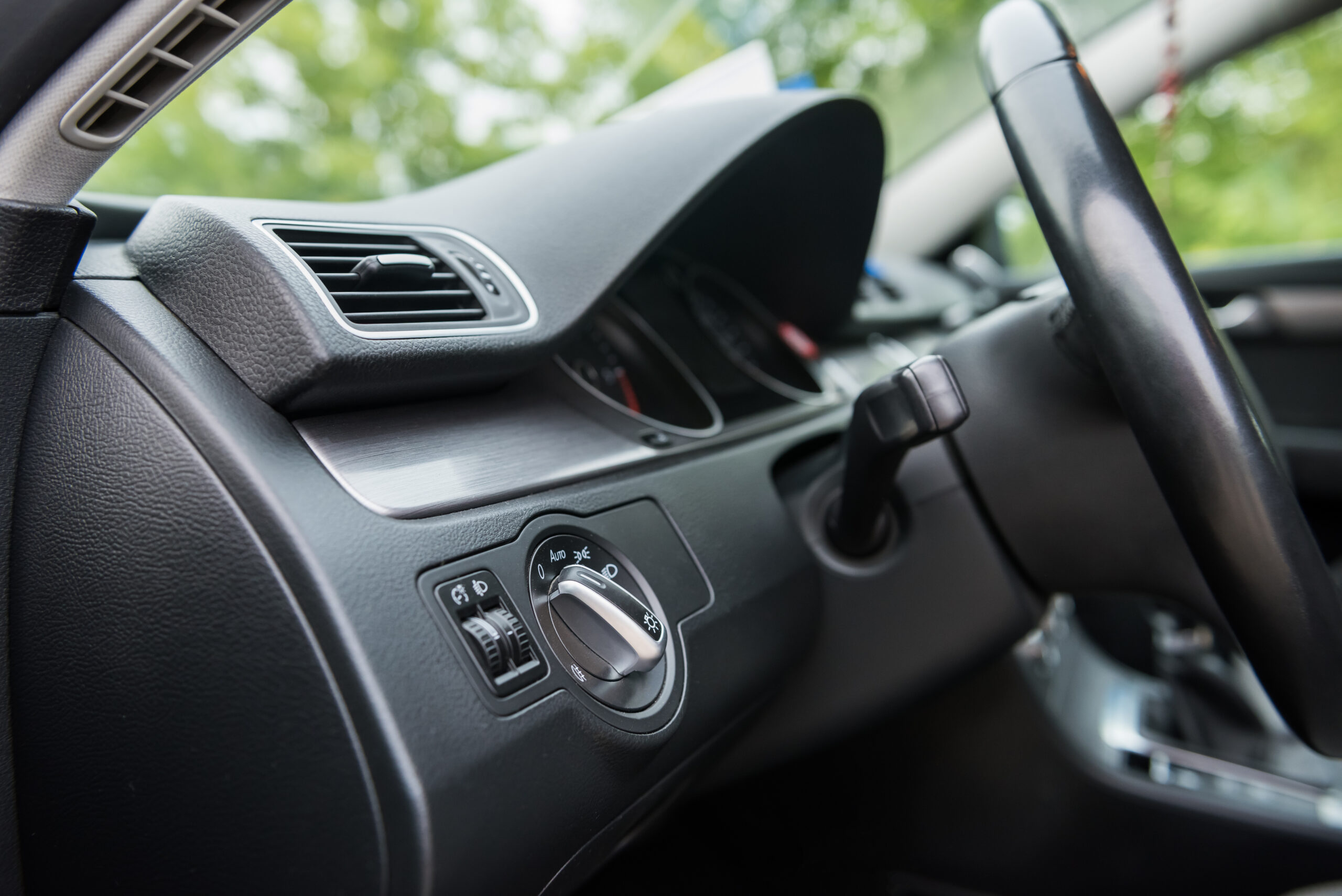 Salon of a new stylish car. Dark car interior.