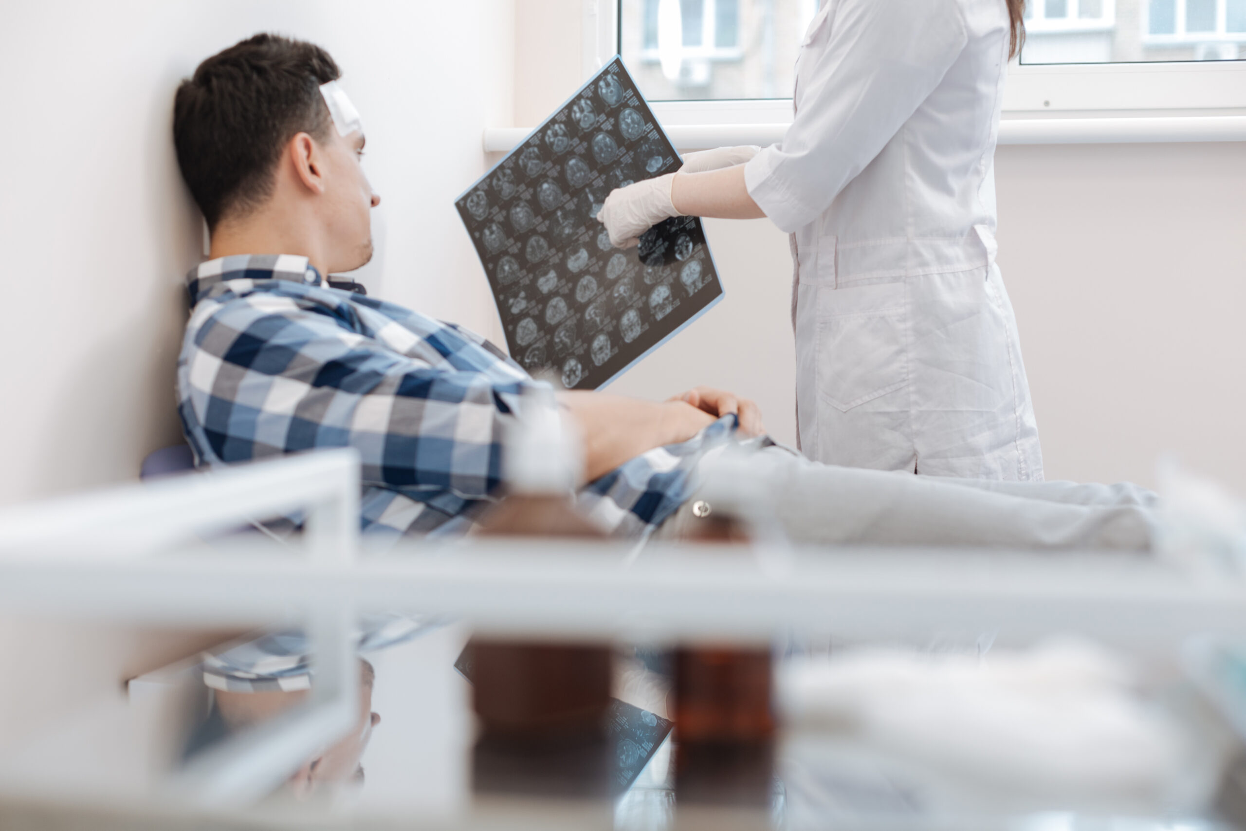 Nice professional doctor pointing at the X ray photo