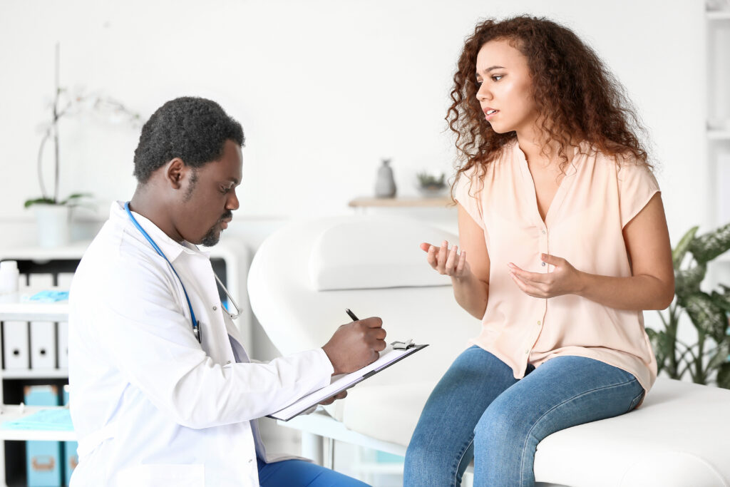 doctor examining patient in clinic